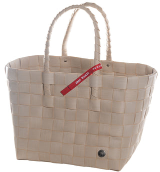 Der Witzgall Shopper 5010-01/0U natur ist eine beige gewebte Einkaufstasche mit geflochtenen Tragegriffen und einem roten Etikett.