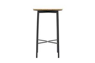 Der hohe, runde Barhocker mit einer Sitzfläche aus Teakholz und schwarzen Metallbeinen ergänzt den Solpuri Bartisch Napoli Ø70cm perfekt in Ihrem Außenbereich.